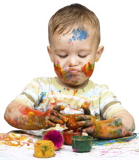 Child with colorful paint on hands and face